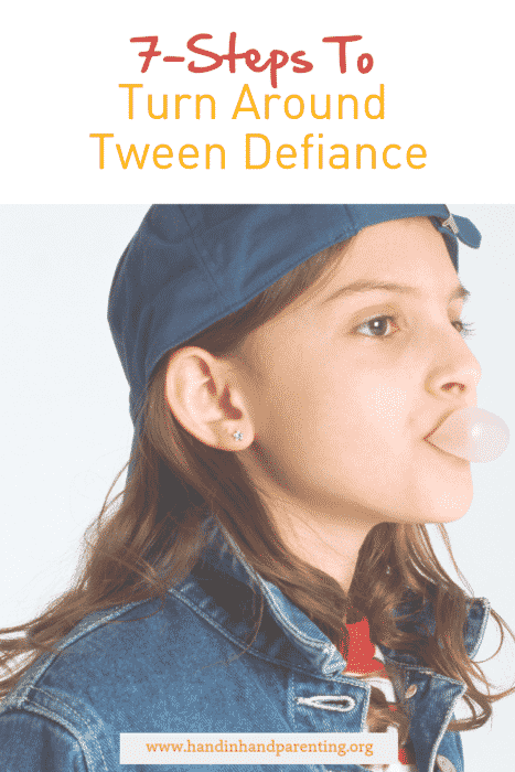 Tween girl blowing bubblegum